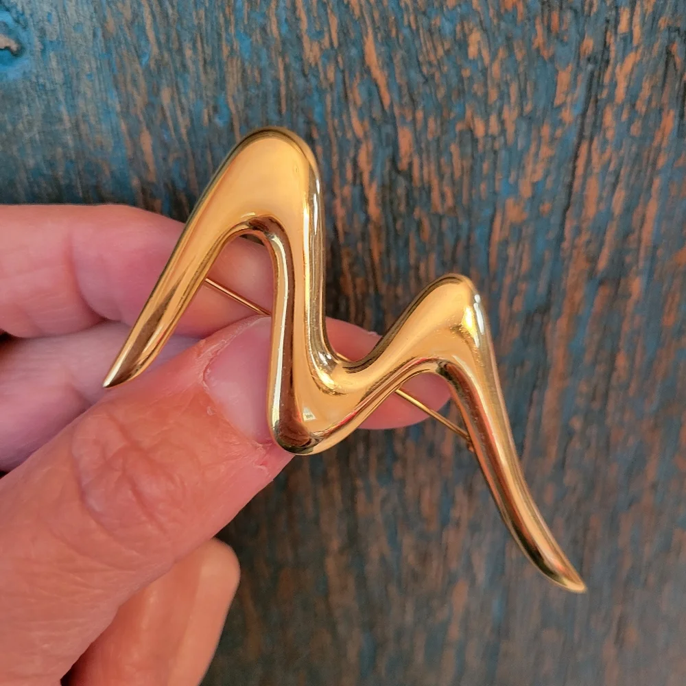 Trifari trio brooches